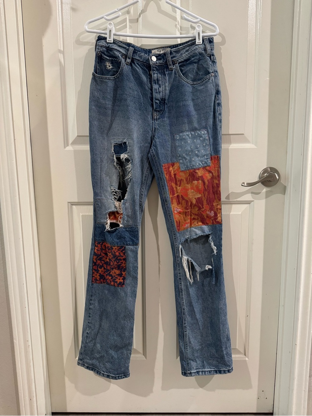 We The Free Flared Patchwork & Embroidered Jeans in Blue with Orange Accents
